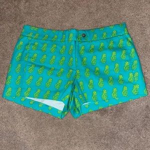 Size 4 yellow pineapple print green shorts.